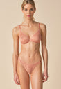 Full-body view of a women model wearing Gossard cafe crème  Thong