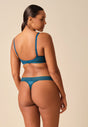 General view of a women model wearing Gossard teal microfibre Sheer Bra