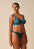 General view of a women model wearing Gossard teal  Thong