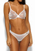 Full-body view of a women model wearing Gossard white  Thong