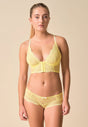 Full-body view of a women model wearing Gossard lemon microfibre Deep V Bralet