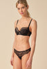 General view of a women model wearing Gossard black  Balcony
