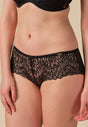 Front view of a women model wearing Gossard black  Short