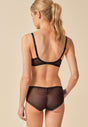 General view of a women model wearing Gossard black  Short