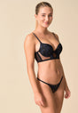 General view of a women model wearing Gossard black  Padded Longline Bra