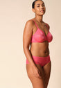 General view of a women model wearing Gossard paradise pink microfibre Sheer Bra