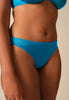 Front view of a women model wearing Gossard atomic blue microfibre Thong