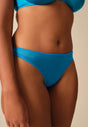 Front view of a women model wearing Gossard atomic blue microfibre Thong