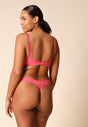 General view of a women model wearing Gossard paradise pink microfibre Thong