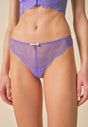 Front view of a women model wearing Gossard purple hebe microfibre Thong