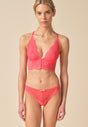 Full-body view of a women model wearing Gossard sugar coral microfibre Thong