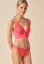 General view of a women model wearing Gossard sugar coral microfibre Thong