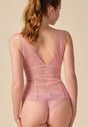 Back view of a women model wearing Gossard soft pink  Cami