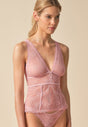 General view of a women model wearing Gossard soft pink  Cami