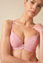 Front view of a women model wearing Gossard soft pink  Padded Plunge Bra