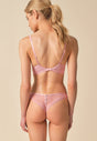 General view of a women model wearing Gossard soft pink  Padded Plunge Bra