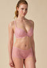 General view of a women model wearing Gossard soft pink  Padded Plunge Bra