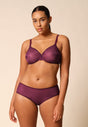 General view of a women model wearing Gossard grape wine microfibre Sheer Bra