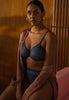 General view of a women model wearing Gossard shadow blue microfibre Sheer Bra
