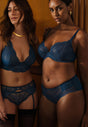 General view of a women model wearing Gossard deep teal microfibre Non Padded Plunge Bra