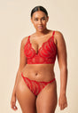 Full-body view of a women model wearing Gossard red  Thong