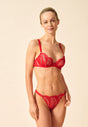 General view of a women model wearing Gossard red  Thong