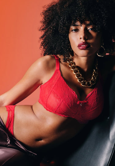 General view of a women model wearing Gossard chilli red microfibre Non Wired Bra