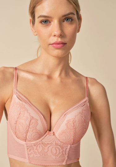 Front view of a women model wearing Gossard blush microfibre Padded Longline Bra