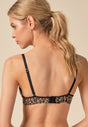 General view of a women model wearing Gossard animal print microfibre Sheer Bra