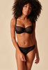 Full-body view of a women model wearing Gossard black microfibre Brief