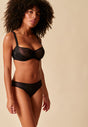 General view of a women model wearing Gossard black microfibre Brief