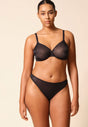 Full-body view of a women model wearing Gossard black microfibre Sheer Bra