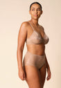 General view of a women model wearing Gossard beige microfibre Sheer Bra