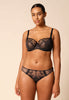 General view of a women model wearing Gossard black microfibre Brief