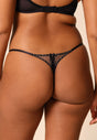 Back view of a women model wearing Gossard black microfibre Thong