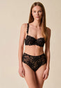 Full-body view of a women model wearing Gossard black microfibre Deep Brief