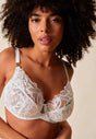 General view of a women model wearing Gossard white microfibre High Apex Non Padded Bra