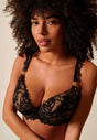 General view of a women model wearing Gossard black microfibre Padded Plunge Bra