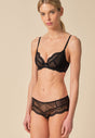 General view of a women model wearing Gossard black microfibre Non Padded Plunge Bra