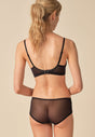 General view of a women model wearing Gossard black microfibre Non Wired Bra