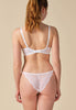 General view of a women model wearing Gossard white microfibre Padded Plunge Bra