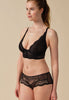 General view of a women model wearing Gossard black microfibre Short