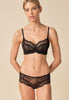General view of a women model wearing Gossard black microfibre Short